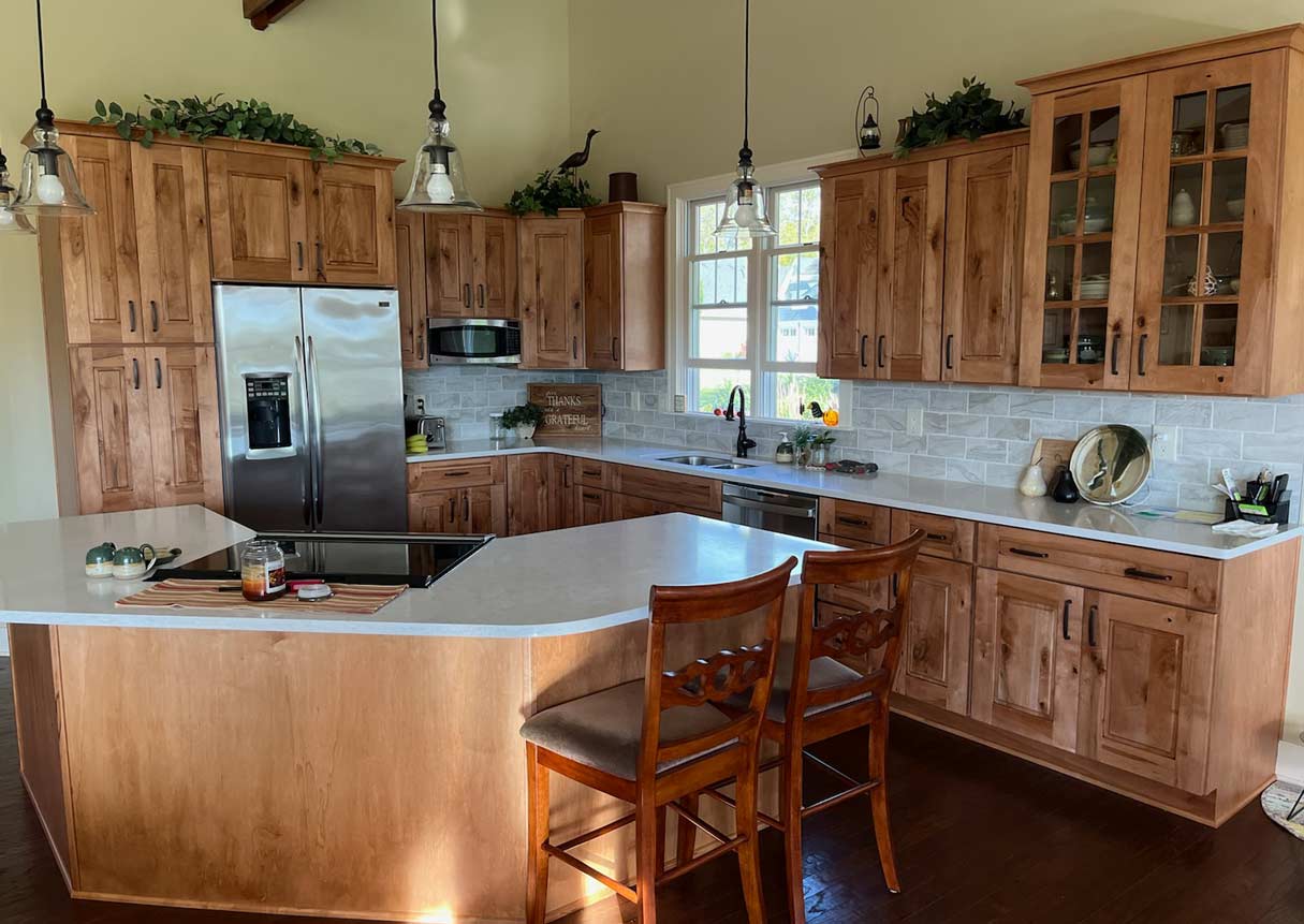 Beautiful custom stained cabinetry inside remodeled DeWitt kitchen